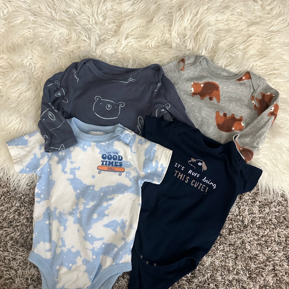 Various onsies. 9-12 months. Two long sleeves. Two short sleeves.